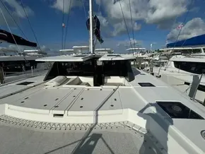 Leopard 50 catamaran, 2020 model, docked at marina under blue sky.