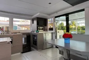 Modern interior of 2022 Leopard 42 yacht with kitchen and dining area.
