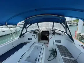 2017 Jeanneau Sun Odyssey 519 sailboat cockpit with blue canopy.