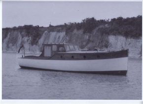 old picture of the boat before sails were added