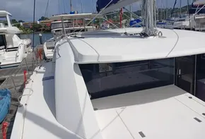 2021 Leopard 40 catamaran docked at marina, showcasing sleek design and spacious deck.