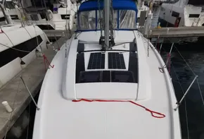 2020 Beneteau Oceanis 46.1 sailboat deck with solar panels in marina.