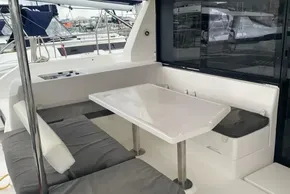 2020 Leopard 40 yacht with outdoor seating and table, docked at marina.