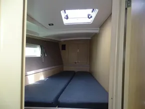 Cabin interior of 2017 Beneteau Oceanis 45 sailboat with twin beds and skylight.