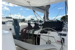 2025 Leopard 46 yacht cockpit with steering wheel and navigation equipment.