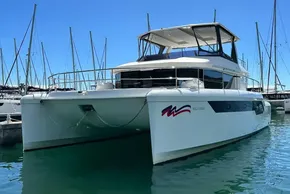 2022 Leopard 53 Powercat yacht docked in marina, clear blue sky background.