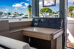 Modern Leopard 46 yacht interior with navigation controls, docked at marina, 2025 model.