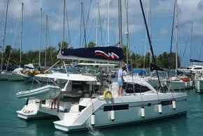 2019 Leopard 40 catamaran docked in a marina with other sailboats.