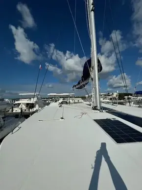 2020 Leopard 50 catamaran deck with solar panels, docked under a clear blue sky.