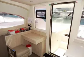 Interior of 2017 Leopard 43 Powercat with desk, chair, and door to deck.