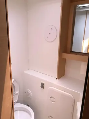 2020 Lagoon 42 yacht bathroom with modern fixtures and wooden accents.