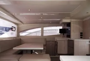 Interior of 2015 Leopard 51 Powercat with modern seating and kitchen area.