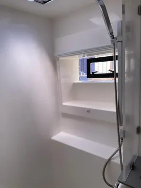Modern shower area in a 2020 Leopard 50 yacht, featuring sleek design and window.