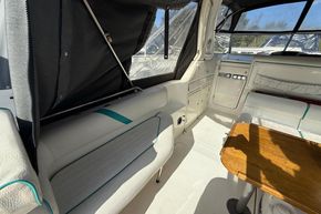 Interior of 1991 Sealine 290 Ambassador boat with seating and wooden table.