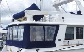 Aft cockpit enclosure with side deck weather doors
