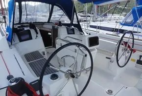 Cockpit of 2017 Jeanneau Sun Odyssey 389 sailboat with dual steering wheels.