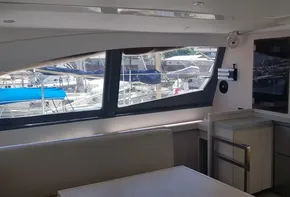 Interior of a 2017 Leopard 48 yacht with modern kitchen and marina view.