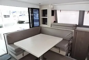2018 Leopard 43 Powercat interior dining area with modern seating and table.