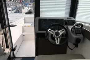 Interior helm of 2024 Leopard 40 Powercat with modern navigation controls.