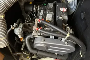 Engine compartment of a 2020 Jeanneau Sun Odyssey 389 sailboat, showcasing mechanical components.