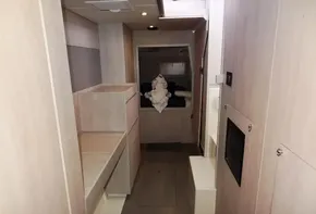 Interior of 2017 Leopard 43 Powercat with light wood finish and cozy cabin.