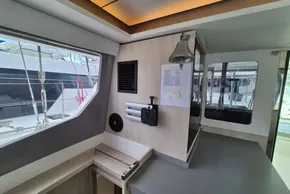 Interior of a 2021 Leopard 45 catamaran with modern design and large windows.