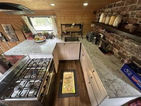 Modern Kitchen with Walk-on glass Wine cellar seamlessly integrated into the floor.