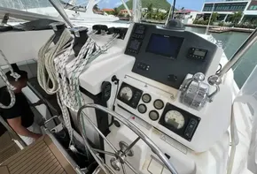 Leopard 45 yacht cockpit with navigation instruments and steering wheel, docked at marina, 2019 model.