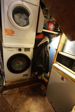 washer, dryer, freezer and microwave area