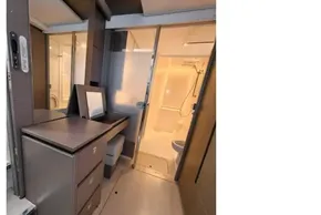 Modern yacht interior with sleek cabinetry and compact bathroom, Leopard 50, 2021 model.
