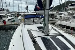 2023 Beneteau Oceanis 51.1 sailboat docked at marina, showcasing sleek design and solar panels.