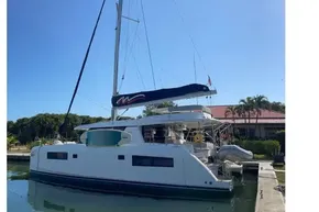 2022 Leopard 45 catamaran docked under clear blue sky.