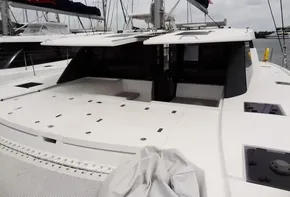 Leopard 50 catamaran, 2020 model, docked at marina, spacious deck and modern design.