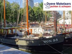 Kotter varend woonschip