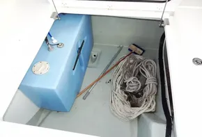 Storage compartment of a 2018 Leopard 43 Powercat with ropes and a blue tank.