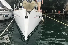 Beneteau Oceanis 41 sailboat docked, 2013 model, anchored in calm waters.