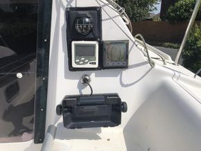 Bulkhead mounted instrument cluster including plotter