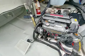 Engine compartment of a 2020 Leopard 45 catamaran with Yanmar engine and fire extinguisher.