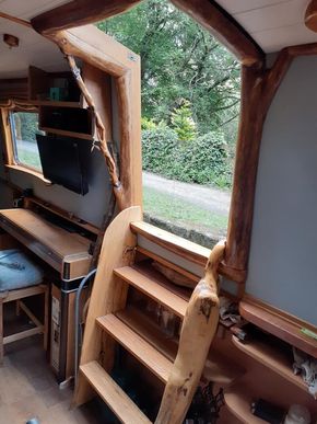 Live edge hatch frame and log ladder can be easily swapped to either side hatch