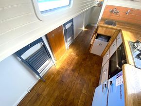 Folding chairs and lift up table stove beneath the guns
