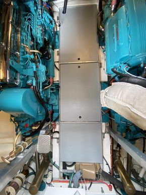 Engine room - view down from wheelhouse hatch, with generator aft of the central gangway (bottom of the image)