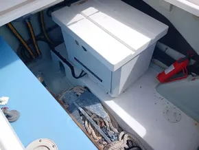 Storage compartment in a 2021 Leopard 40 boat with ropes and equipment.