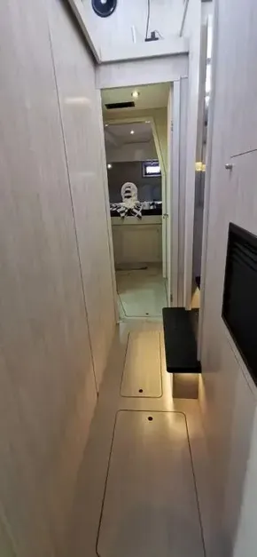 Interior hallway of 2019 Leopard 51 Powercat yacht with modern wooden finish.