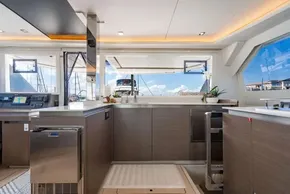 Luxurious interior of 2022 Leopard 50 yacht with modern kitchen and panoramic windows.