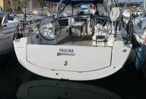 2019 Beneteau Oceanis 41.1 sailboat docked in marina, rear view.