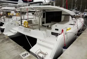 2020 Lagoon 42 catamaran docked at marina, rear view.