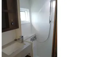 Bathroom interior of 2020 Lagoon 46 yacht with modern fixtures and shower.