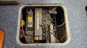 Yanmar engine in a 1998 Haines 335 boat, visible through a floor hatch.