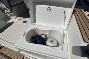 Open storage compartment on Jeanneau Sun Odyssey 389 yacht, showing gas cylinders, 2020 model.