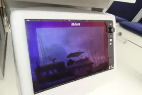 B&G navigation display on 2017 Beneteau Oceanis 45 yacht, reflecting marina scene.